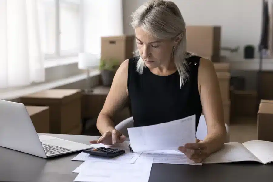 Self employed woman, work on home loan and concentrating at home office desk